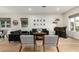 Open living area with hardwood floors, comfy seating, and a home bar at 1078 W Spur Ct, Gilbert, AZ 85233