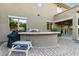 Outdoor kitchen with built-in grill and counter space at 1078 W Spur Ct, Gilbert, AZ 85233