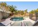 Relaxing pool with lounge chairs and palm trees at 1078 W Spur Ct, Gilbert, AZ 85233