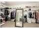 Spacious walk-in closet with ample shelving and hanging space at 1078 W Spur Ct, Gilbert, AZ 85233
