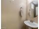 Small bathroom with pedestal sink and oval mirror at 1094 S Agnes Ln, Gilbert, AZ 85296
