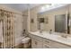 Bathroom with double sinks, shower/tub combo, and updated fixtures at 1094 S Agnes Ln, Gilbert, AZ 85296