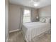 Cozy bedroom with a queen-size bed and neutral decor at 1094 S Agnes Ln, Gilbert, AZ 85296
