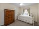 Small bedroom with daybed and wooden dresser at 1094 S Agnes Ln, Gilbert, AZ 85296