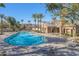 Relaxing community pool with lounge chairs and palm trees at 1094 S Agnes Ln, Gilbert, AZ 85296