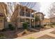 Two-story home with balcony, brick facade, and walkway at 1094 S Agnes Ln, Gilbert, AZ 85296
