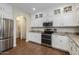 Modern kitchen with stainless steel appliances and white cabinetry at 1094 S Agnes Ln, Gilbert, AZ 85296