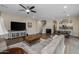 Open concept living room with hardwood floors and kitchen views at 1094 S Agnes Ln, Gilbert, AZ 85296
