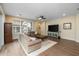 Living room with hardwood floors, two sofas, and a TV at 1094 S Agnes Ln, Gilbert, AZ 85296