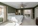Main bedroom with private balcony and ceiling fan at 1094 S Agnes Ln, Gilbert, AZ 85296
