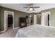 Main bedroom with walk-in closet and TV at 1094 S Agnes Ln, Gilbert, AZ 85296
