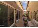 Private patio with seating area and outdoor fireplace at 1094 S Agnes Ln, Gilbert, AZ 85296