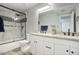 Modern bathroom with double vanity, granite countertop, and a shower/tub combo at 13422 N 52Nd St, Scottsdale, AZ 85254