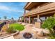 Luxury home with expansive backyard, featuring a fire pit and built-in grill at 14829 N 18Th Pl, Phoenix, AZ 85022