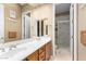 Double vanity bathroom with marble shower and updated fixtures at 14829 N 18Th Pl, Phoenix, AZ 85022