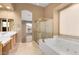 Bathroom featuring a soaking tub, shower, and double vanity at 14829 N 18Th Pl, Phoenix, AZ 85022