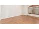 Bright bedroom featuring hardwood floors and a large window at 14829 N 18Th Pl, Phoenix, AZ 85022