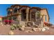 Beautiful multi-level home with a stone waterfall feature in the landscaped front yard at 14829 N 18Th Pl, Phoenix, AZ 85022