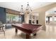 Game room with pool table and stained glass lighting at 14829 N 18Th Pl, Phoenix, AZ 85022