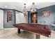 Game room with pool table and built-in shelving at 14829 N 18Th Pl, Phoenix, AZ 85022