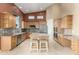 Eat-in kitchen with granite countertops, stainless steel appliances, and ample cabinet space at 14829 N 18Th Pl, Phoenix, AZ 85022