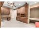 Spacious home office with built-in cabinetry and desk at 14829 N 18Th Pl, Phoenix, AZ 85022