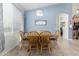 Charming dining area with wooden table set, bathed in soft light from a nearby window at 1493 E Robinson Way, Chandler, AZ 85225