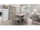 Cozy dining area featuring stylish furniture, a display cabinet, and abundant natural light at 1493 E Robinson Way, Chandler, AZ 85225