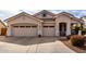 Charming single-story home featuring a two-car garage and well-maintained front yard landscaping at 1493 E Robinson Way, Chandler, AZ 85225