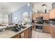 Well-equipped kitchen featuring modern appliances, a spacious island, and seamless flow into the dining area at 1493 E Robinson Way, Chandler, AZ 85225