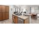 This kitchen has an open concept layout with an island overlooking the living room at 1493 E Robinson Way, Chandler, AZ 85225