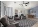 Open-concept living room with comfortable seating and an adjacent dining area, perfect for entertaining at 1493 E Robinson Way, Chandler, AZ 85225