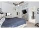 Comfortable main bedroom with neutral tones, ceiling fan, and closet access at 1493 E Robinson Way, Chandler, AZ 85225