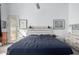 This primary bedroom includes outdoor access and decor over the bed's headboard at 1493 E Robinson Way, Chandler, AZ 85225