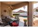 Covered patio overlooking a sparkling pool, perfect for outdoor entertaining at 1493 E Robinson Way, Chandler, AZ 85225