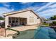 Inviting covered patio near a sparkling in-ground pool, perfect for outdoor relaxation at 1493 E Robinson Way, Chandler, AZ 85225