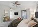 Main bedroom with a TV, access to a patio and neutral tones at 15050 N Thompson Peak Pkwy # 2033, Scottsdale, AZ 85260