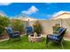 Backyard firepit with seating area at 15348 W Banff Ln, Surprise, AZ 85379