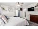 Main bedroom with king bed, dark wood dresser, and ceiling fan at 15348 W Banff Ln, Surprise, AZ 85379
