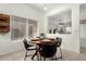 Kitchen dining area with a round wooden table and four chairs at 15348 W Banff Ln, Surprise, AZ 85379