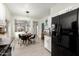 Modern kitchen with white cabinets and black appliances at 15348 W Banff Ln, Surprise, AZ 85379