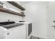 Laundry room with washer, dryer, and shelving at 15348 W Banff Ln, Surprise, AZ 85379