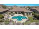 Luxury home with a large pool and spa, outdoor kitchen, and expansive backyard at 18111 W Desert Sage Dr, Goodyear, AZ 85338