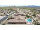 Aerial view of a luxury home with a private pool and stunning mountain views at 18111 W Desert Sage Dr, Goodyear, AZ 85338