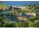 Aerial view of community amenities including tennis & basketball courts, playground, and lake access at 18111 W Desert Sage Dr, Goodyear, AZ 85338