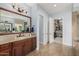 Bathroom boasts a spacious vanity, walk-in closet, and tile flooring at 18111 W Desert Sage Dr, Goodyear, AZ 85338