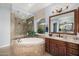 Elegant bathroom with soaking tub, walk-in shower, and double vanity at 18111 W Desert Sage Dr, Goodyear, AZ 85338