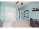 Versatile bedroom with a built-in desk and ample closet space at 18111 W Desert Sage Dr, Goodyear, AZ 85338