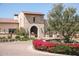Inviting community entrance with stonework and landscaping at 18111 W Desert Sage Dr, Goodyear, AZ 85338