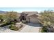 Single-story home with landscaped yard and two-car garage at 18111 W Desert Sage Dr, Goodyear, AZ 85338